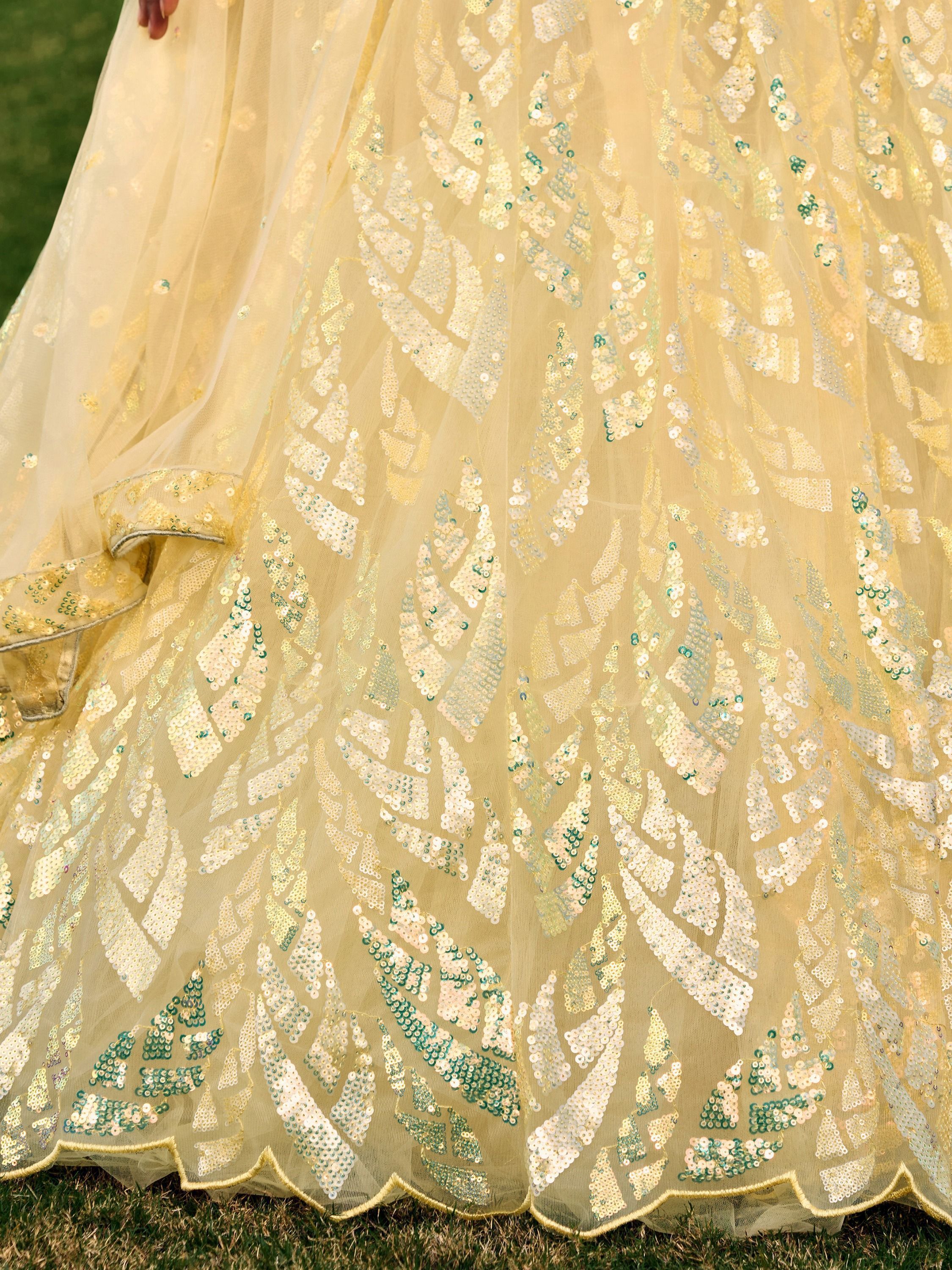 Yellow soft net lehenga choli with heavy multi sequins embroidery and lace border dupatta perfect for weddings receptions and glam parties